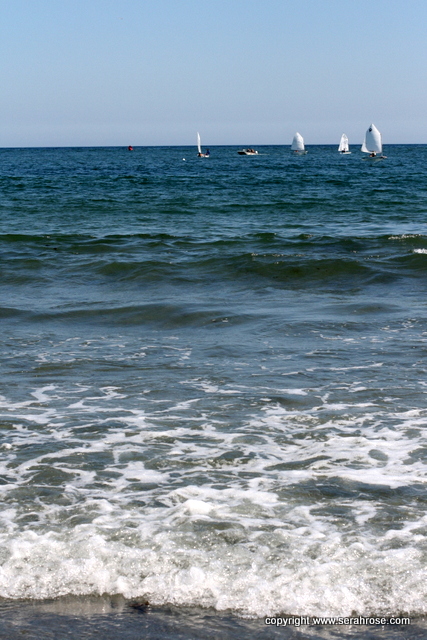 Atlantic ocean with tiny learning sailboats